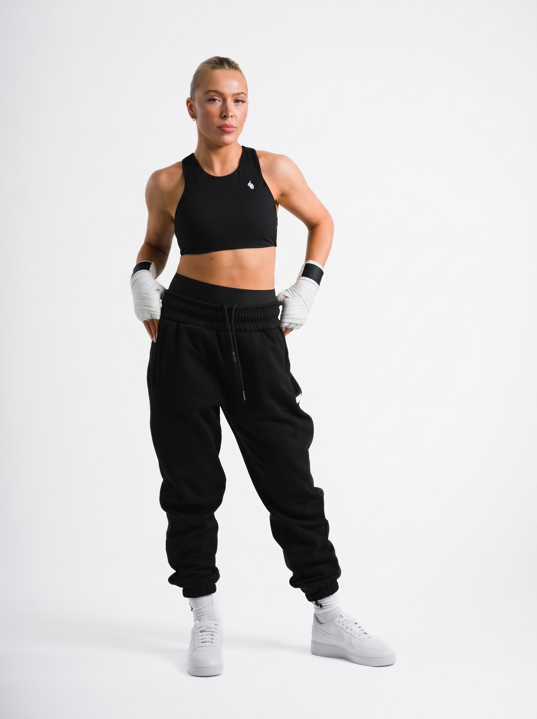 Female model wearing black ONE BOUT Script Bottoms