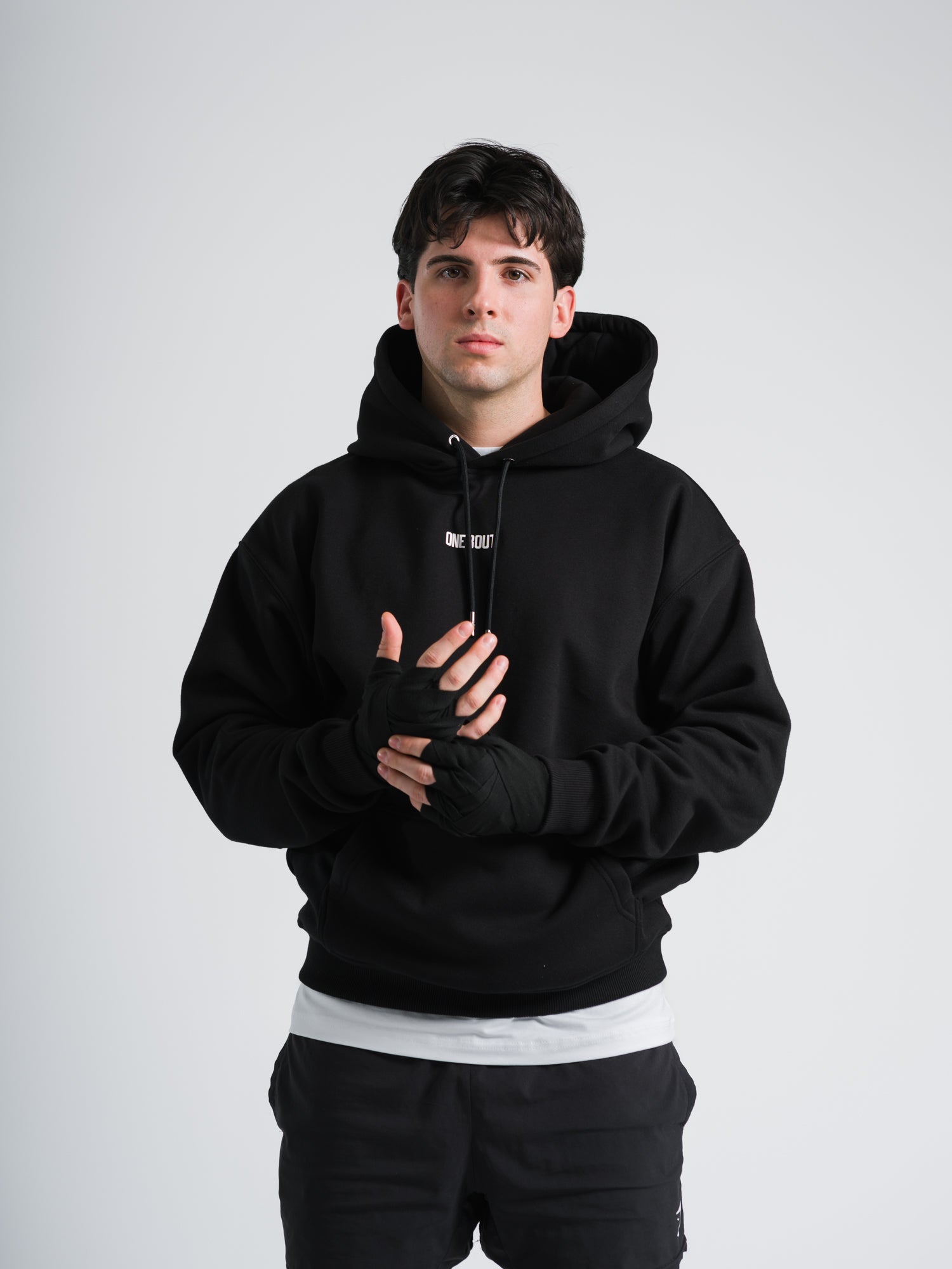 ONE BOUT Men's Script Oversized Hoodie (Limited) in Black — front view