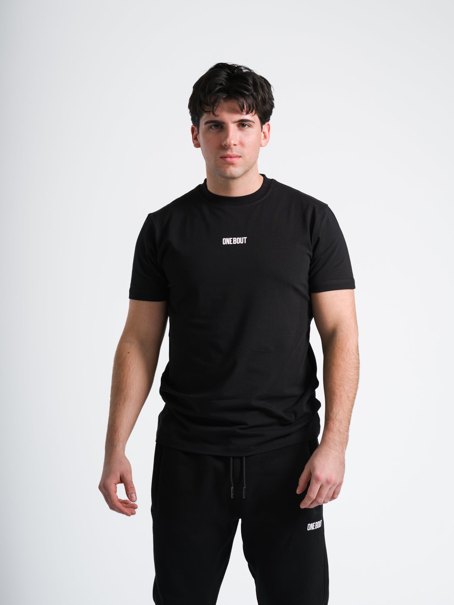 Male model wearing black ONE BOUT Script T-Shirt