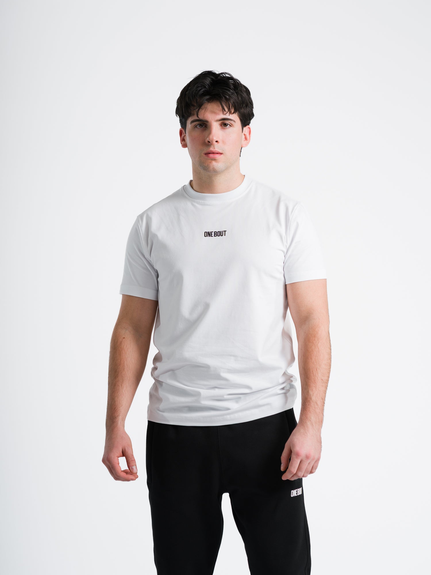 Male model wearing white ONE BOUT Script T-Shirt