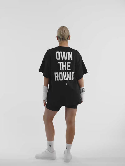 Female model in black ONE BOUT Own The Round oversized t-shirt — fit and movement