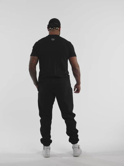 Male model in black ONE BOUT Script T-Shirt Limited edition — fit and movement