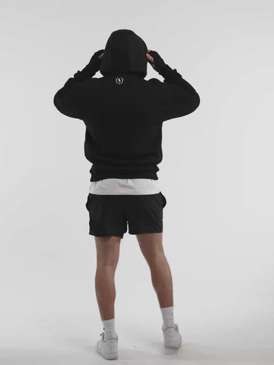Male model in black ONE BOUT Script Oversized Hoodie Limited edition — fit and movement