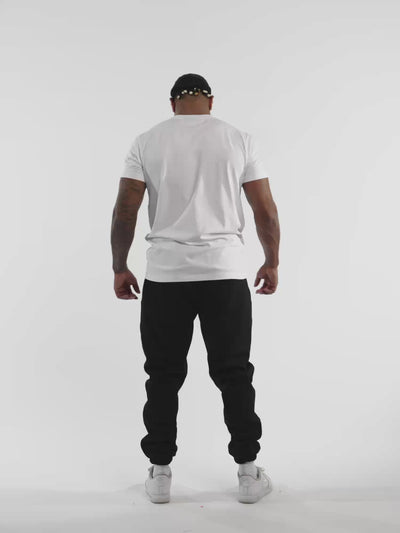 Male model in white ONE BOUT Line T-Shirt — fit and movement