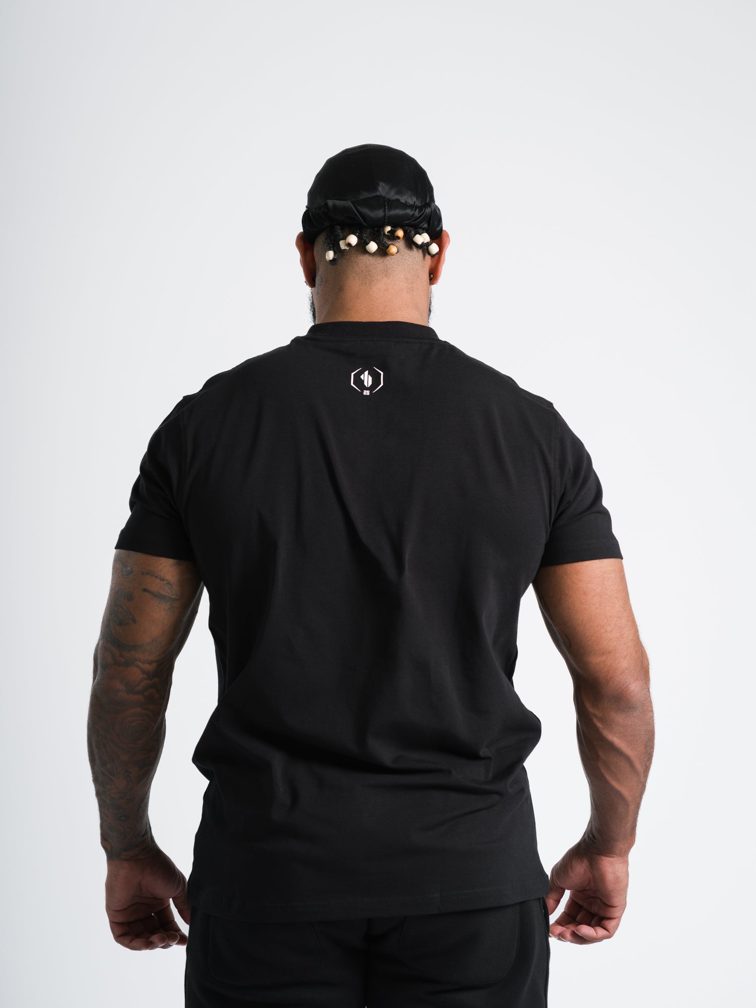 Male model wearing black ONE BOUT Script T-Shirt Limited edition back view