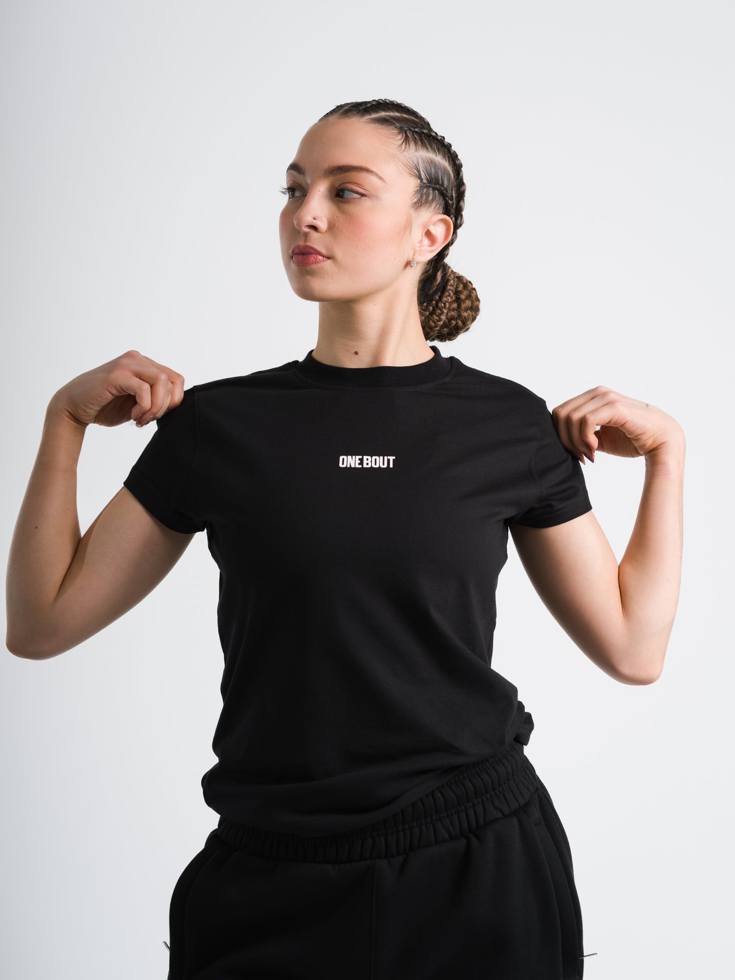Female model wearing black ONE BOUT Script T-Shirt
